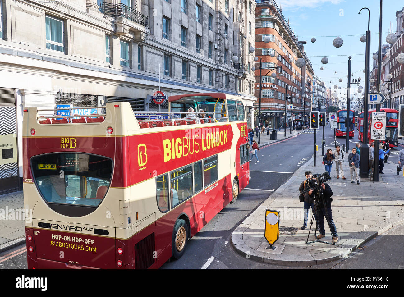 The hop-on hop-of Big Bus double decker bus enters Oxford street in its tour of London, England. Stock Photo