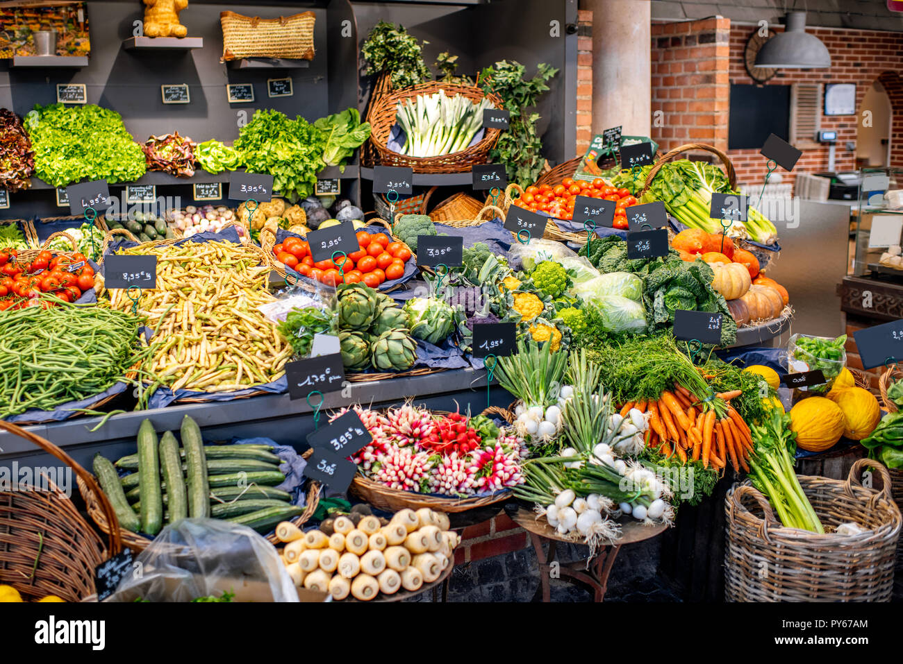Variety of beautifully organized fruits and vegetables on the counter