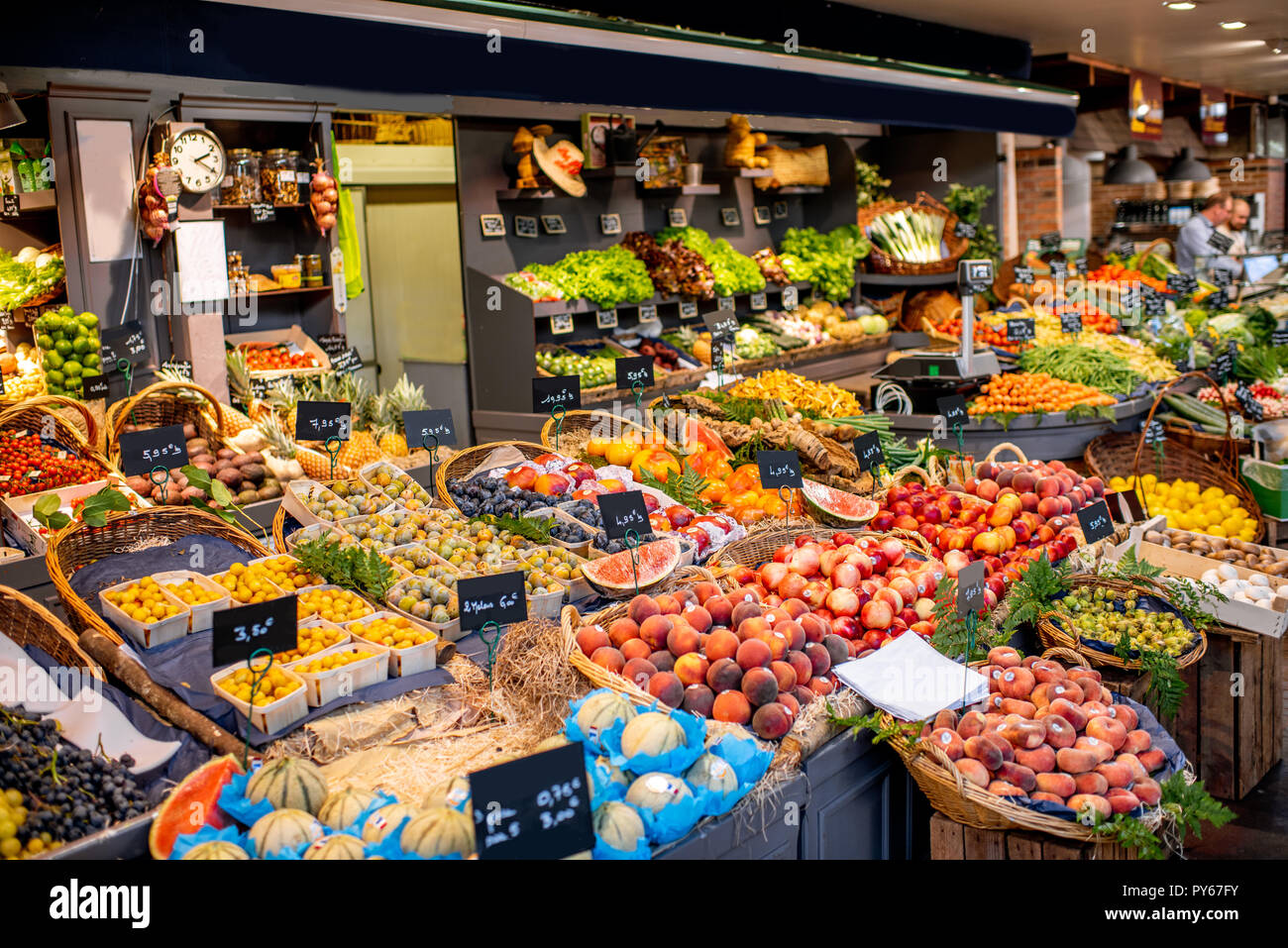 Variety of beautifully organized fruits and vegetables on the counter