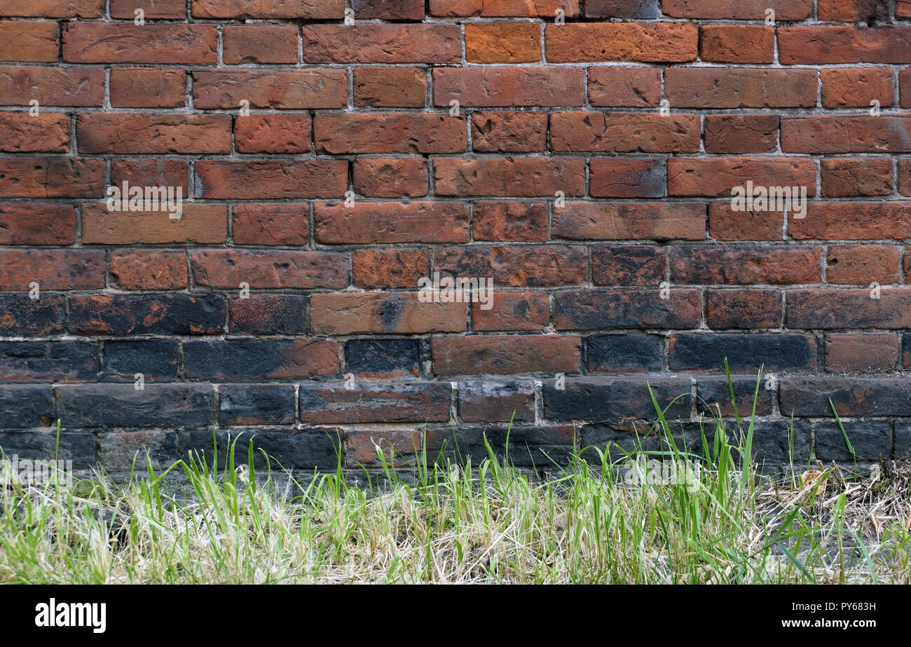 surface of an old red brick wall grunge background texture close up ...