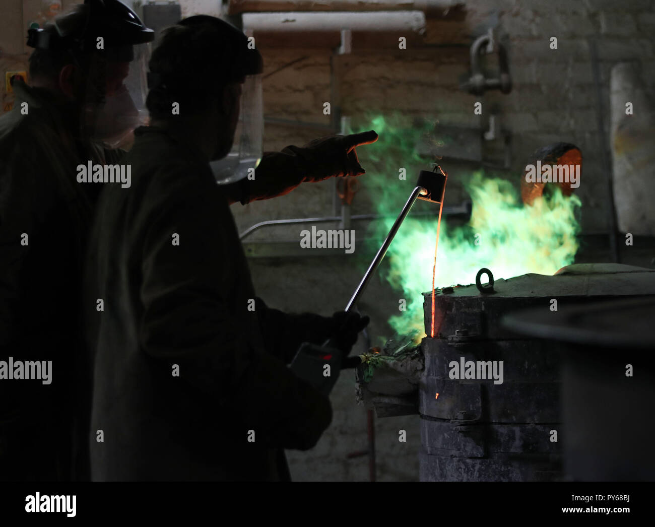 Foundry workers during the casting of Our Emmeline, a bronze statue of