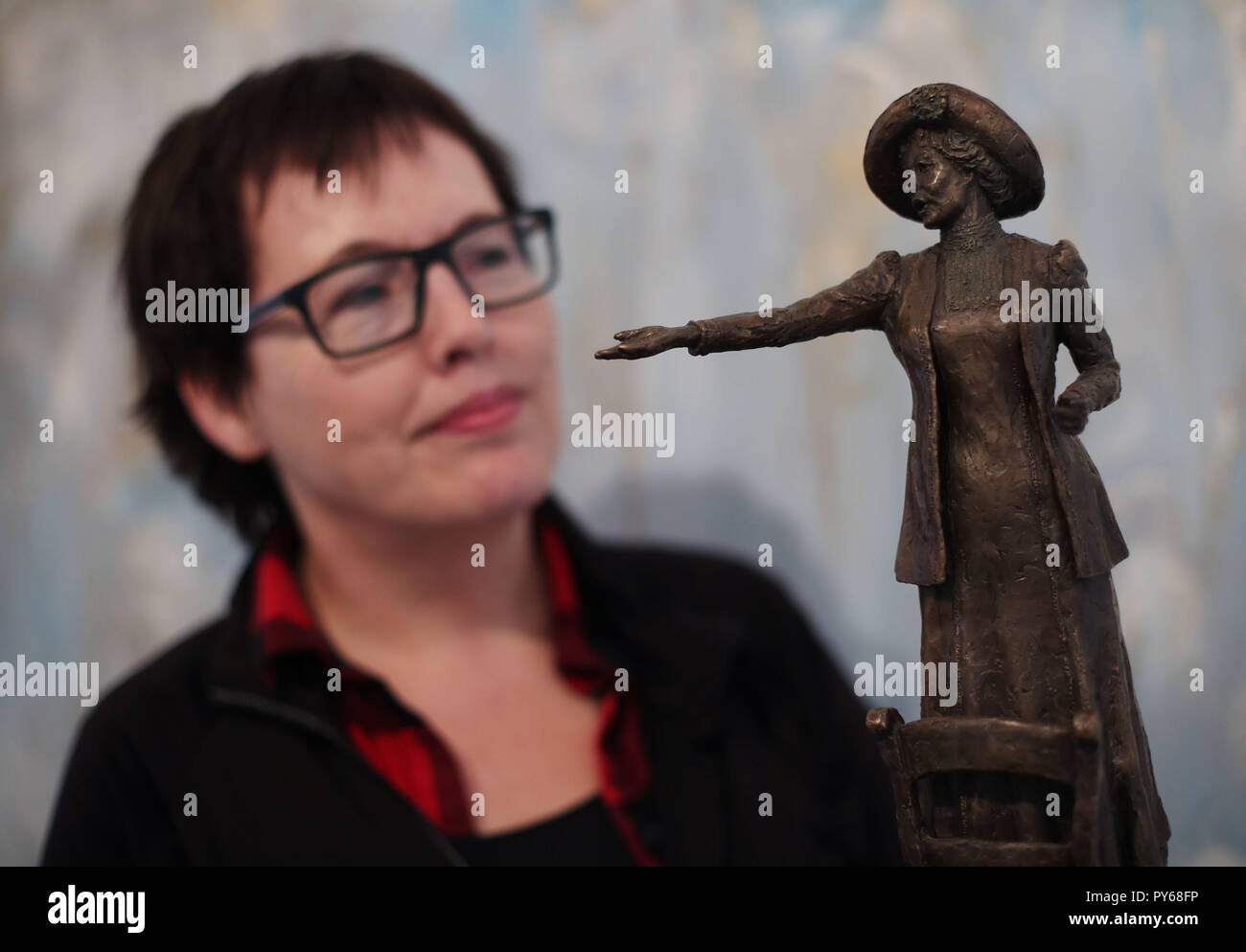 Sculptor Hazel Reeves with a maquette of Our Emmeline, her bronze