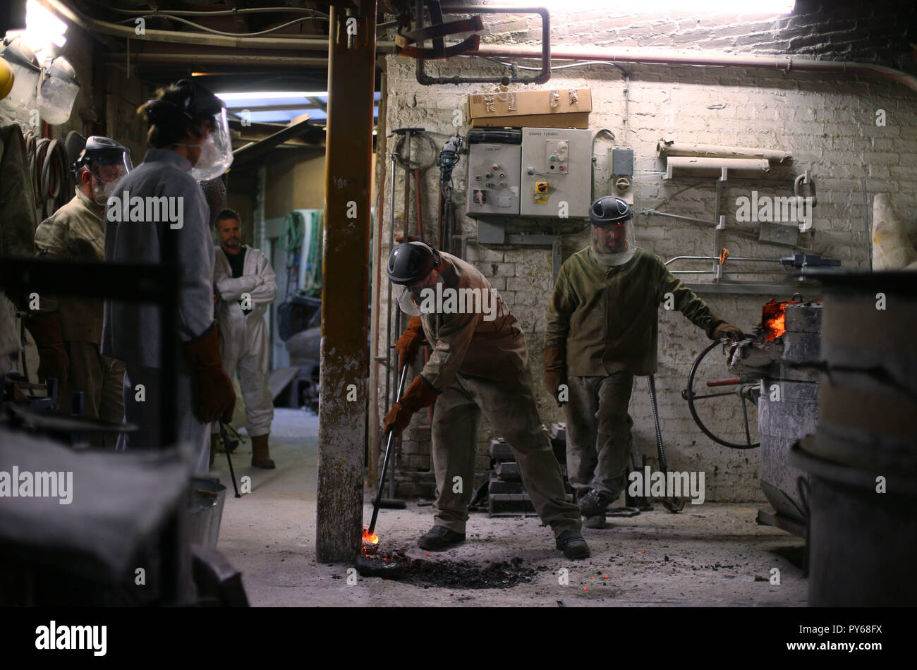 Foundry workers during the casting of Our Emmeline, a bronze statue of