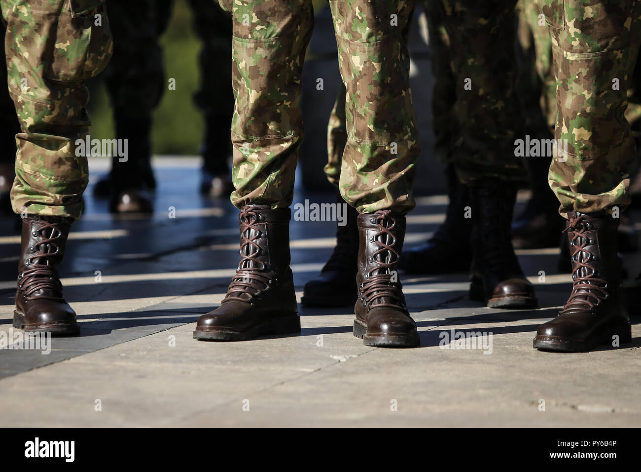 Details with the uniforms, gloves, boots and handguns of soldiers