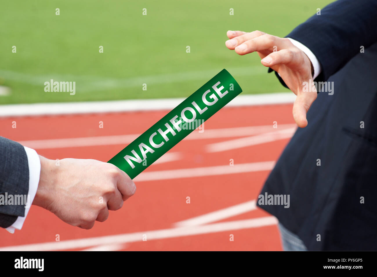 Businessmen passing green baton with german word - Nachfolge Stock Photo