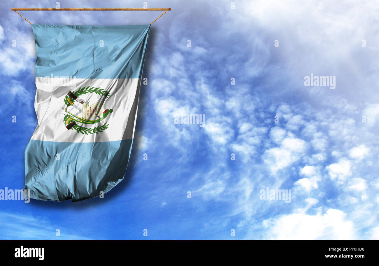 Flag of Guatemala. Vertical flag, against blue sky with place for your text Stock Photo