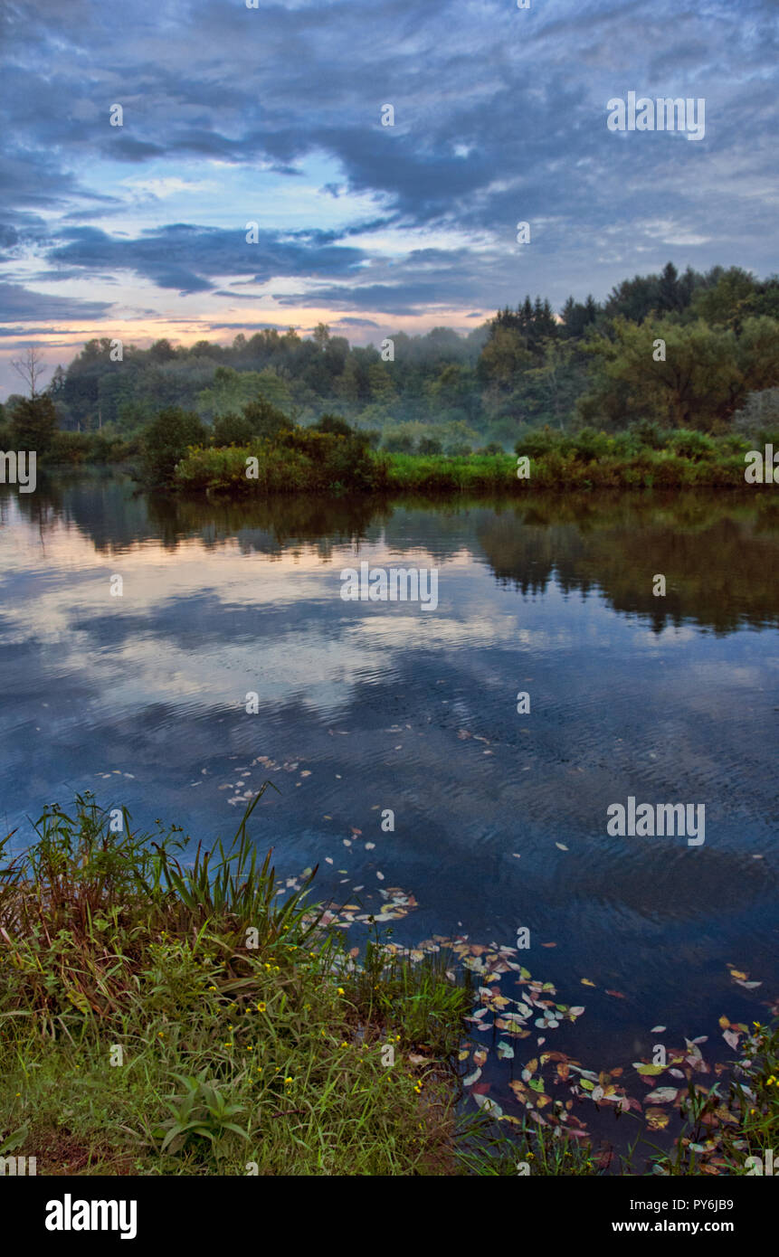 Colorful sunset over pond Stock Photo