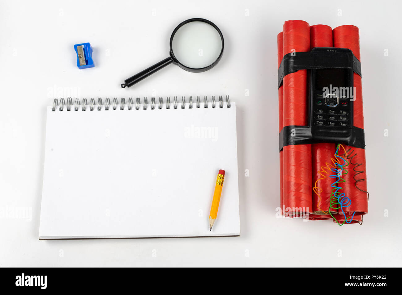 Notebook for taking notes and pencil on the table with explosives ...
