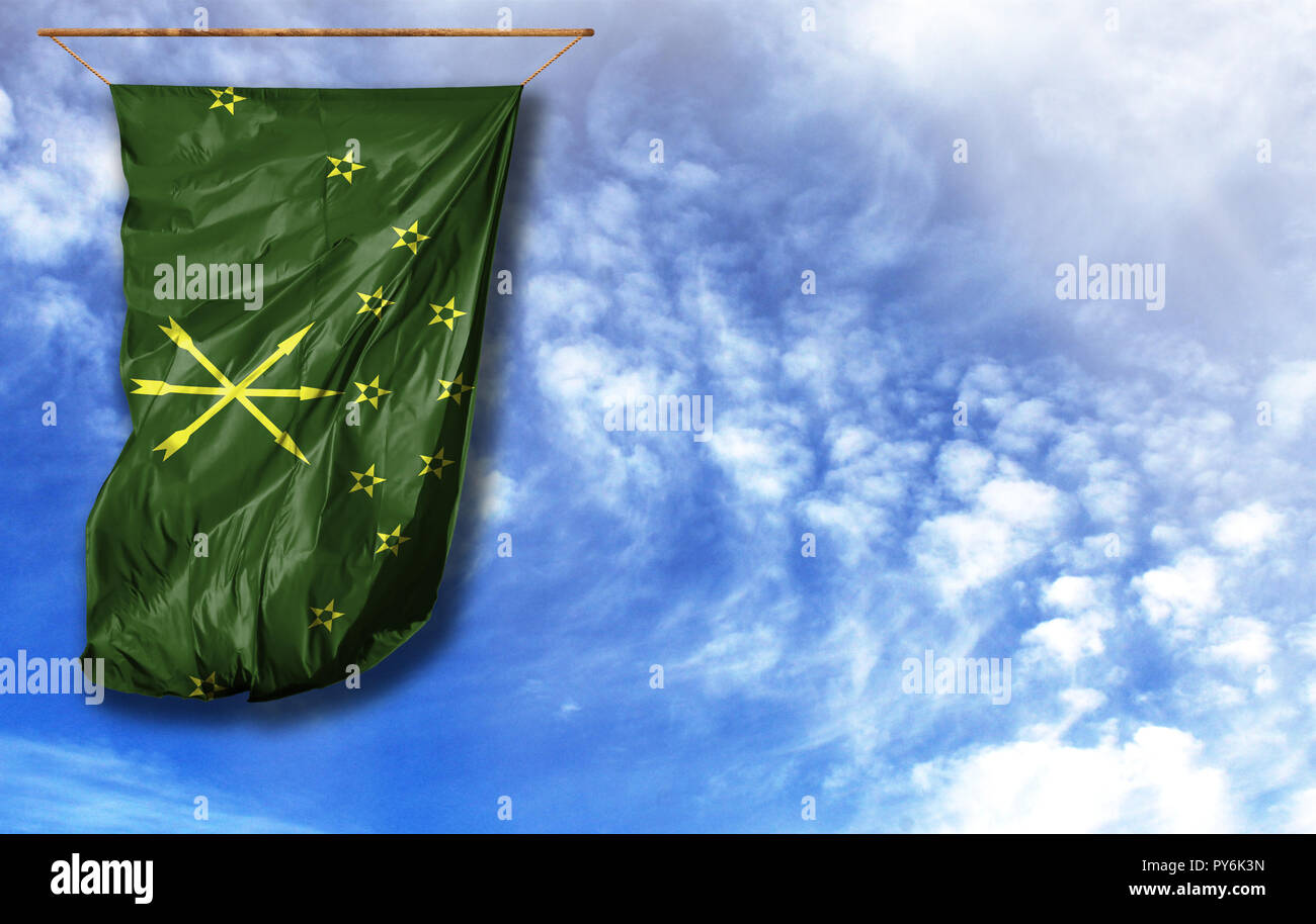 Flag of Adygea. Vertical flag, against blue sky with place for your text Stock Photo
