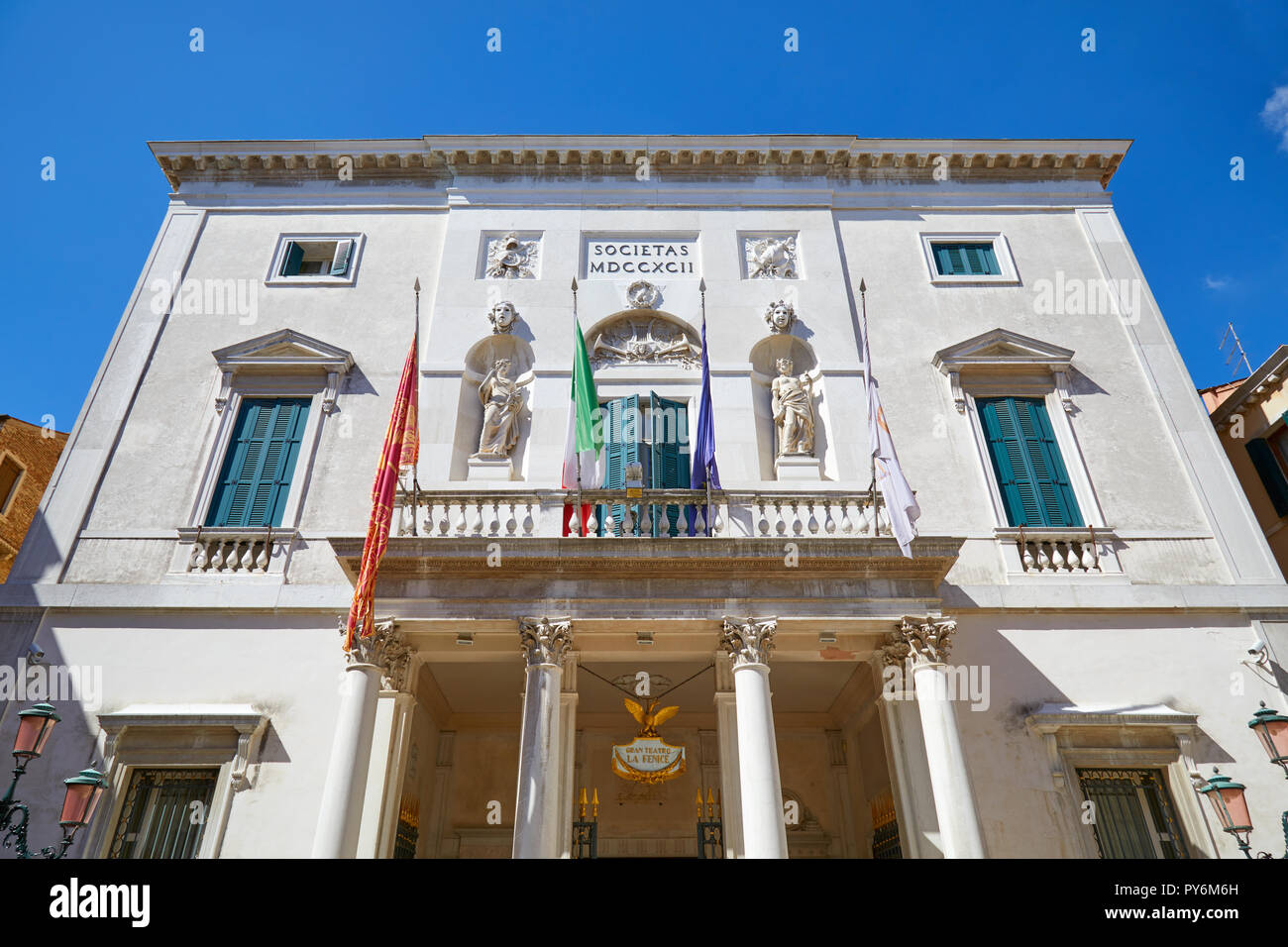 VENICE, ITALY - AUGUST 14, 2017: Theater La Fenice building facade in a sunny summer day, clear blue sky in Venice, Italy Stock Photo