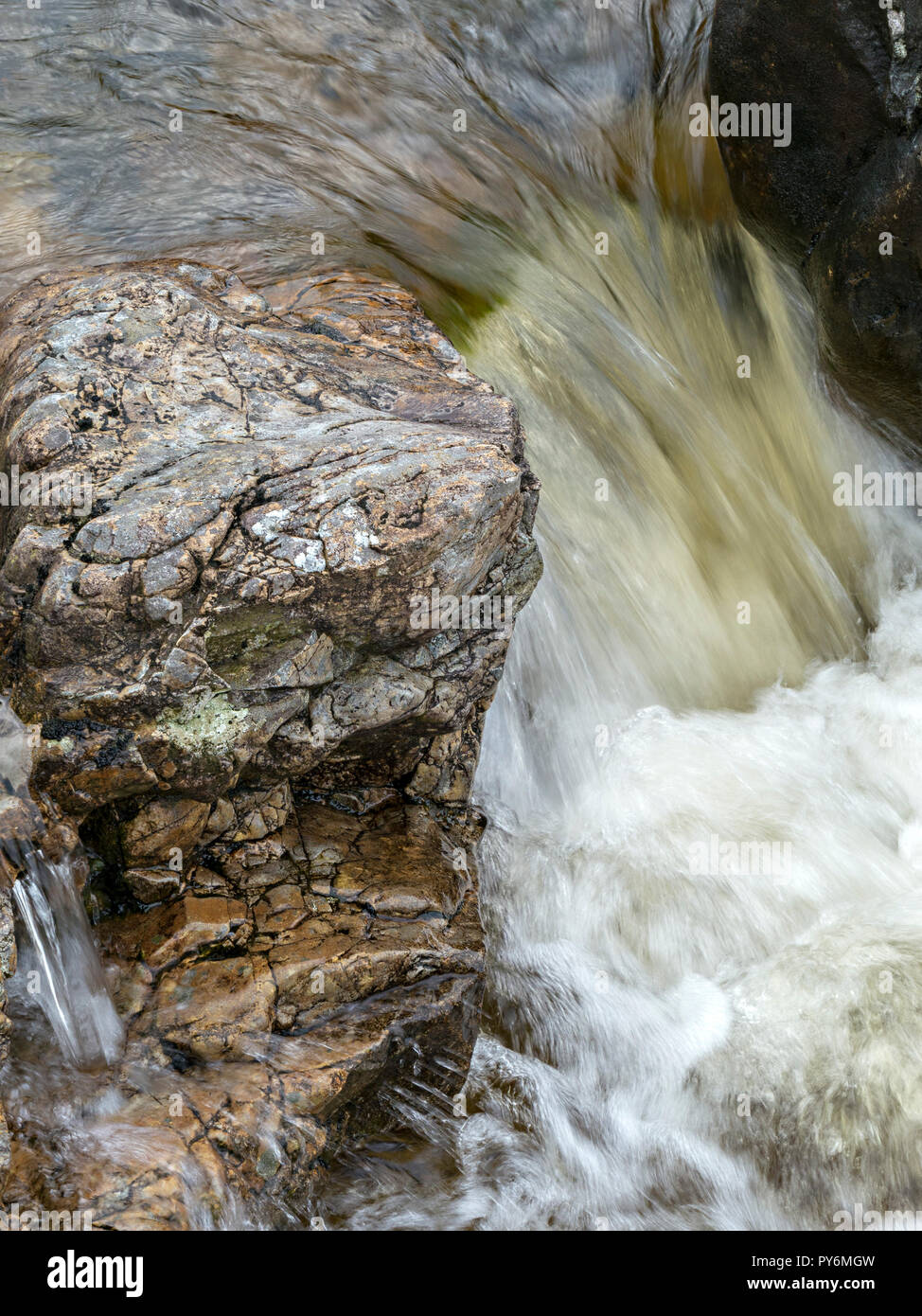 Small rocky waterfall in mountain stream of Abhainn nan Leac, Camasunary, Isle of Skye, Scotland, UK Stock Photo