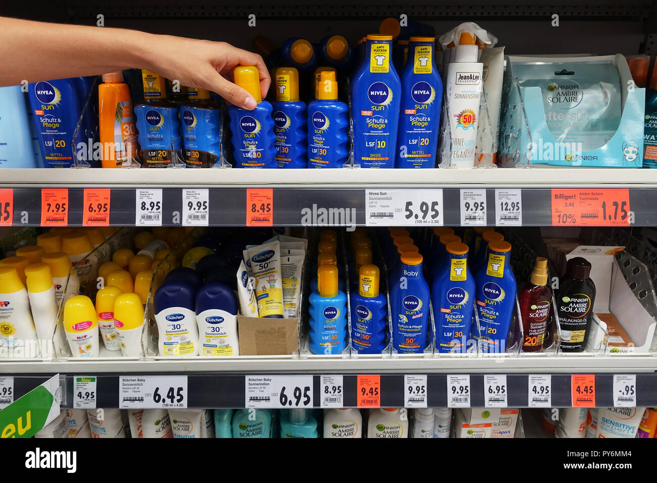 Sunscreen, lotions and oil sprays in a Kaufland hypermarket Stock Photo -  Alamy