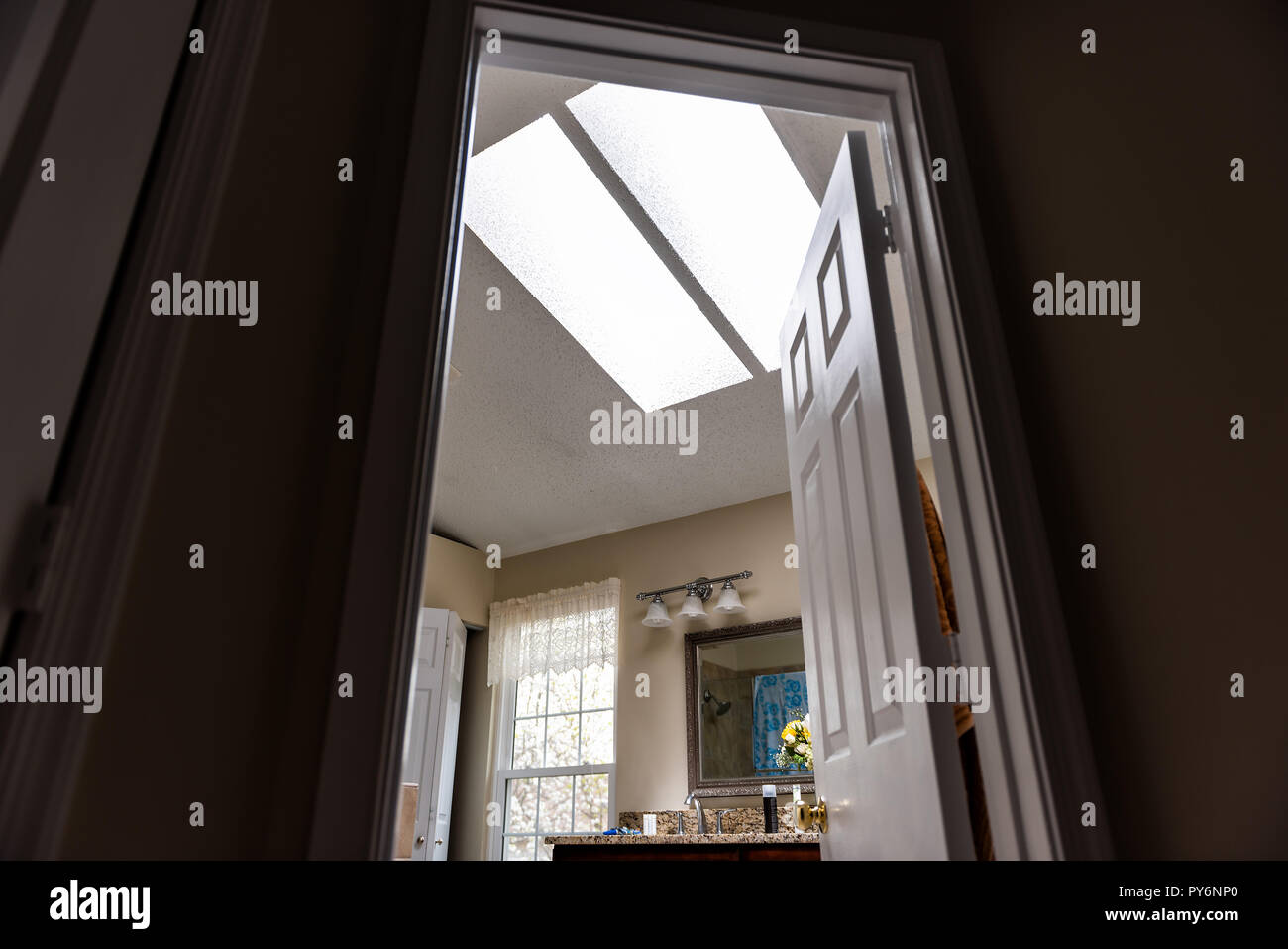 Skylights in bathroom mirror, door entrance, window, wall, bright light sunlight in