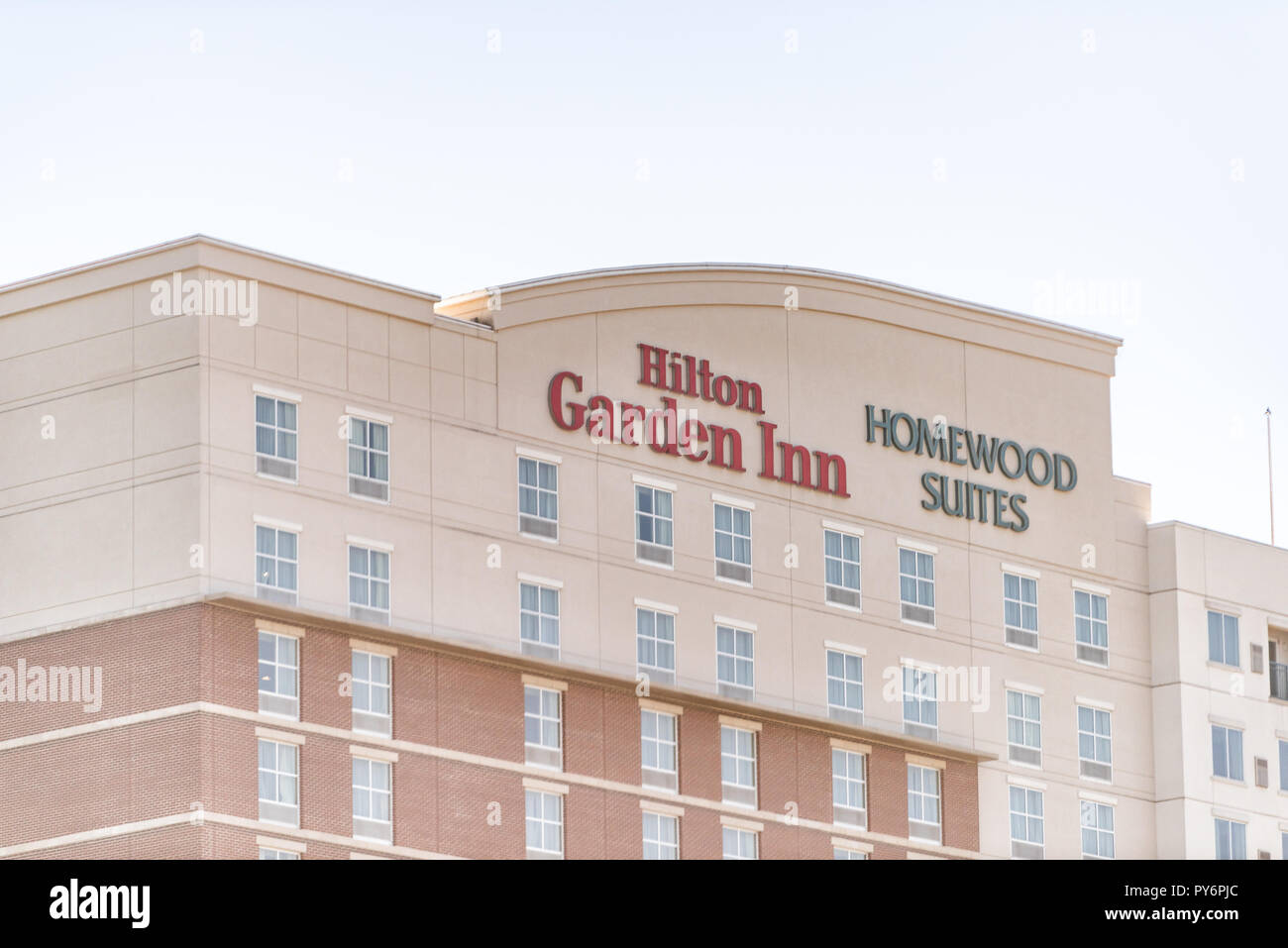 Atlanta, USA - April 20, 2018: Hilton Garden Inn sign on building in Georgia city, Homewood suites, closeup and sky Stock Photo