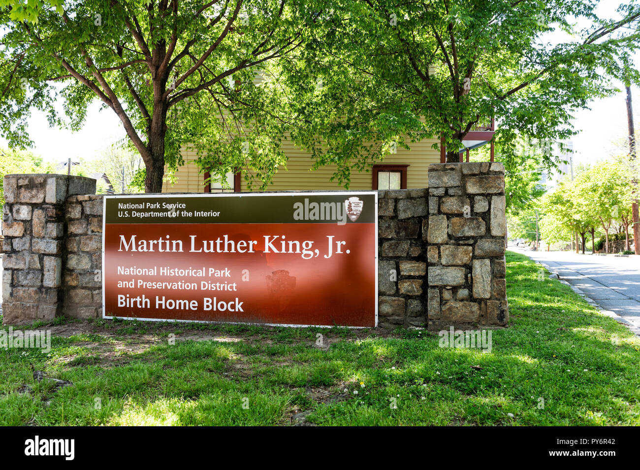 Atlanta, USA - April 20, 2018: Historic MLK Martin Luther King Jr National Park sign of birth home block in Georgia downtown, green trees in urban cit Stock Photo