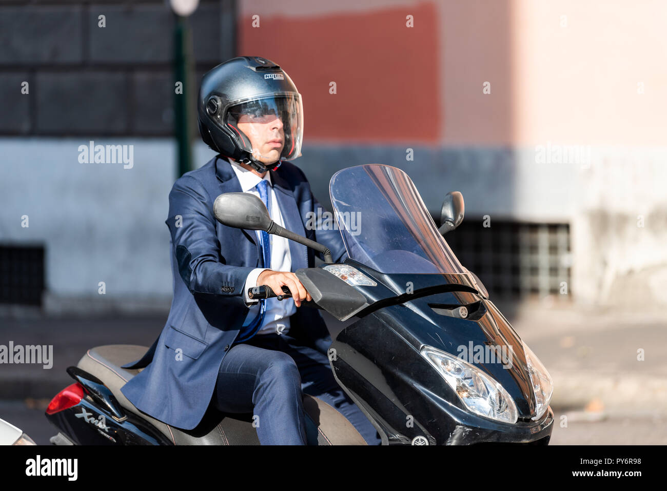 Rome, Italy September 4, 2018 One local Italian man riding scooter