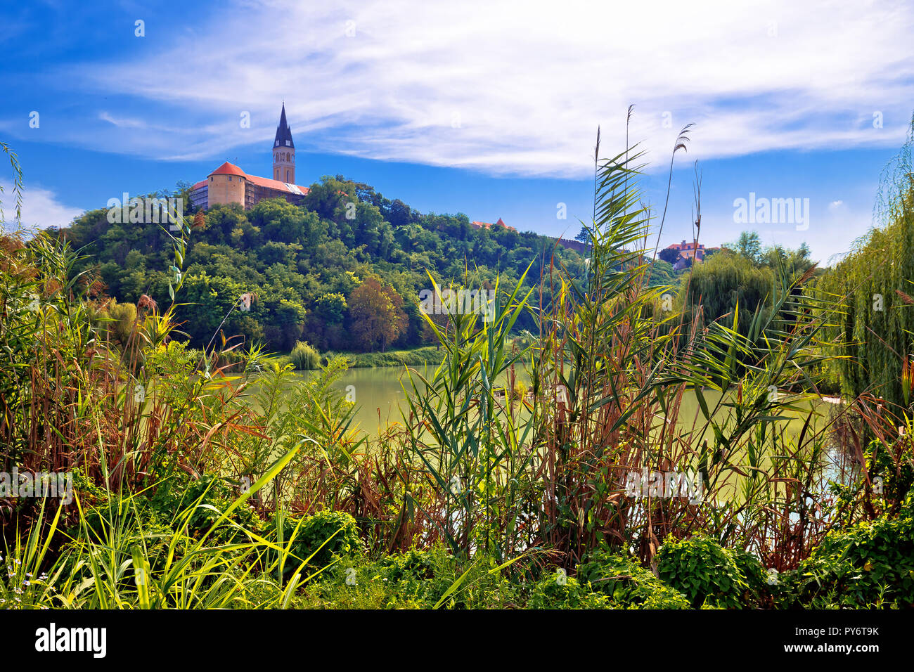 Town of Ilok church on the hill above lake, Slavonija region of Croatia Stock Photo