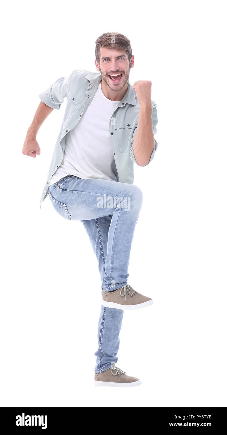 full-length. a happy young man steps forward Stock Photo - Alamy