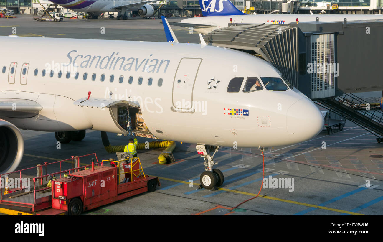 Copenhagen, September 8, 2017: Aircraft pilots preparing to the flight while plane undergoes ground handling Stock Photo