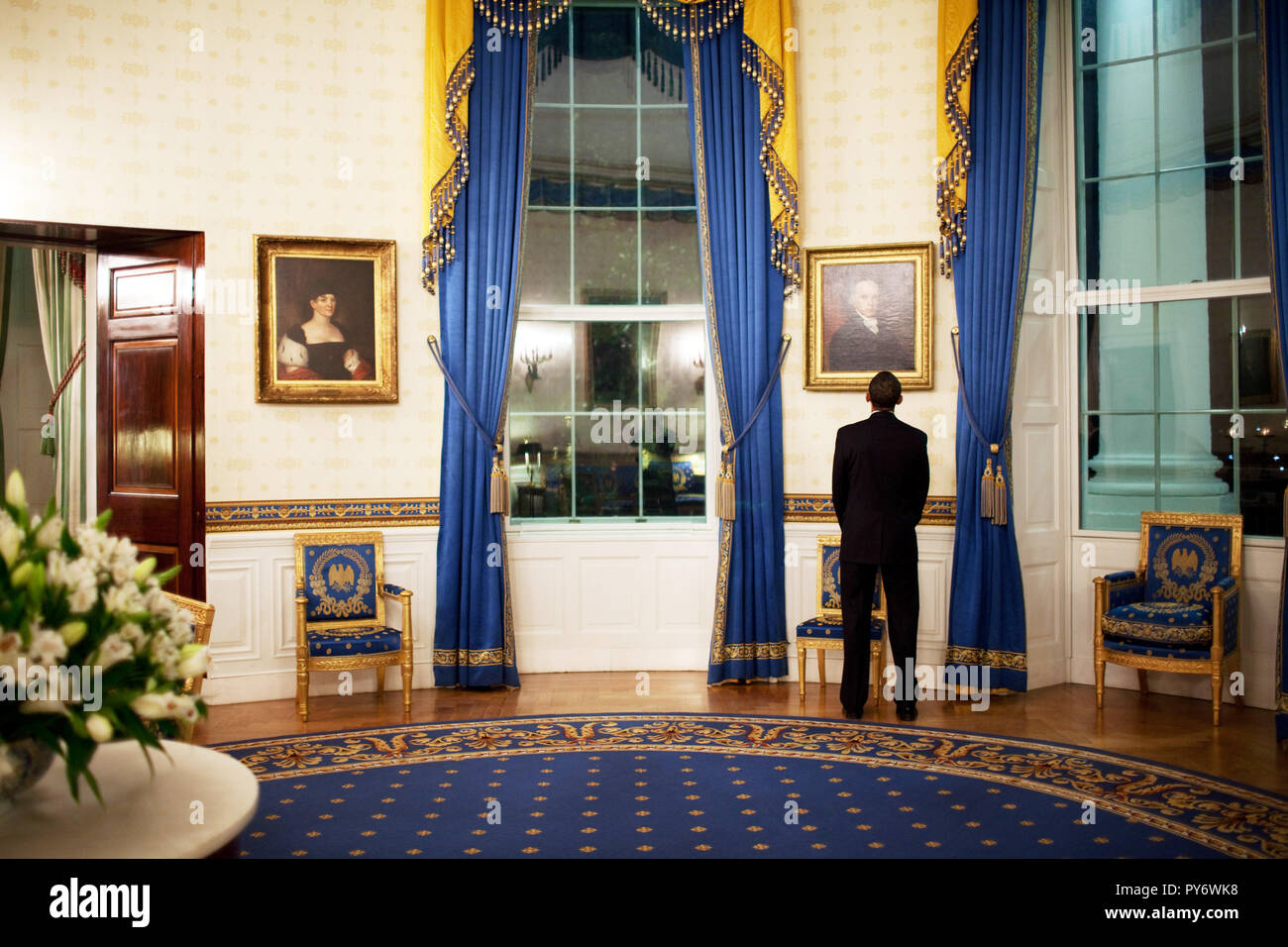 President Barack Obama looks at a portrait of President John Adams while waiting in the Blue Room prior to his press conference in the East Room 2/9/09. Official White House Photo by Pete Souza Stock Photo