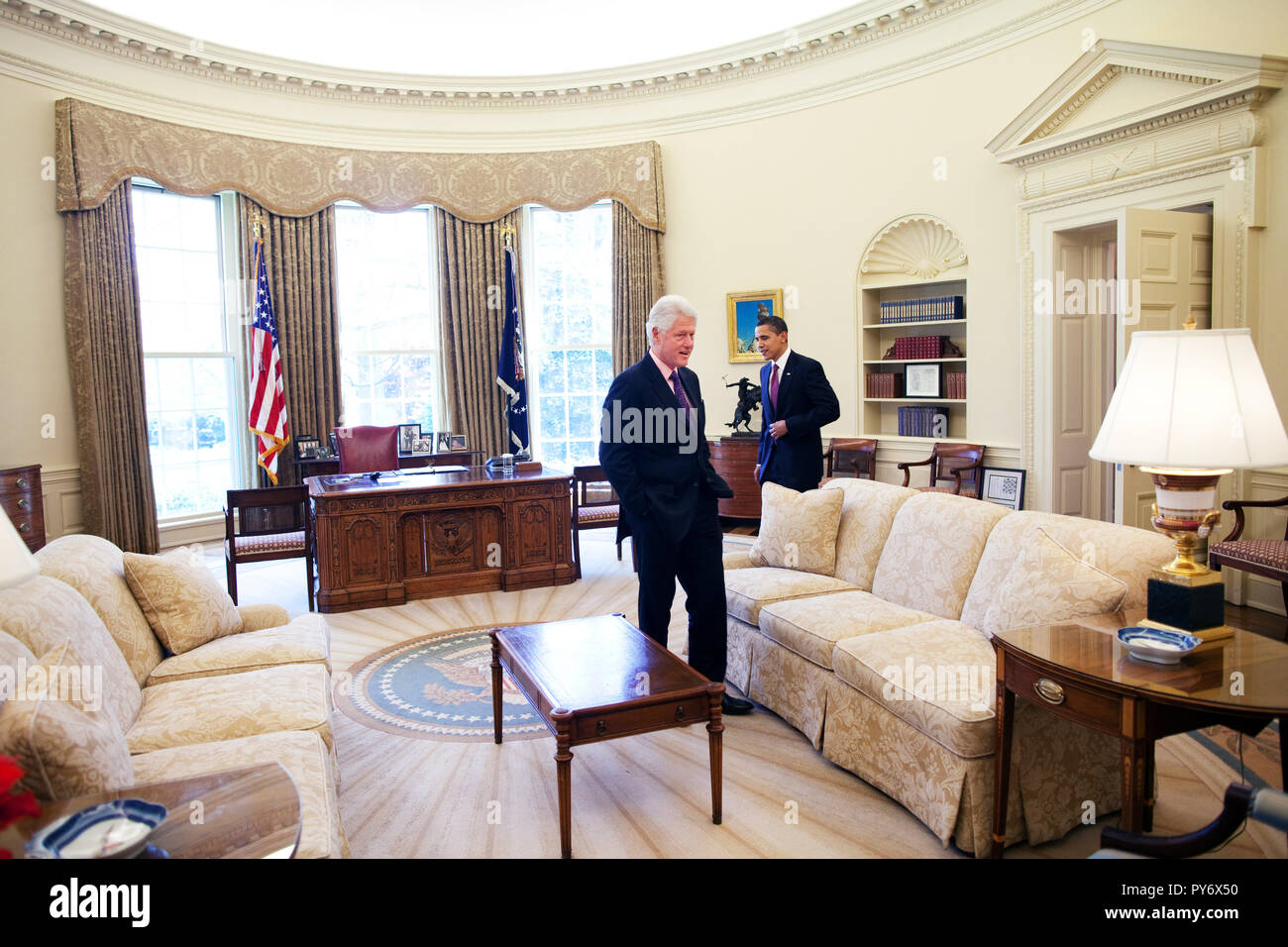 President Barack Obama meets with President Clinton in the Oval Office 4/21/09 Official White House Photo by Pete Souza Stock Photo