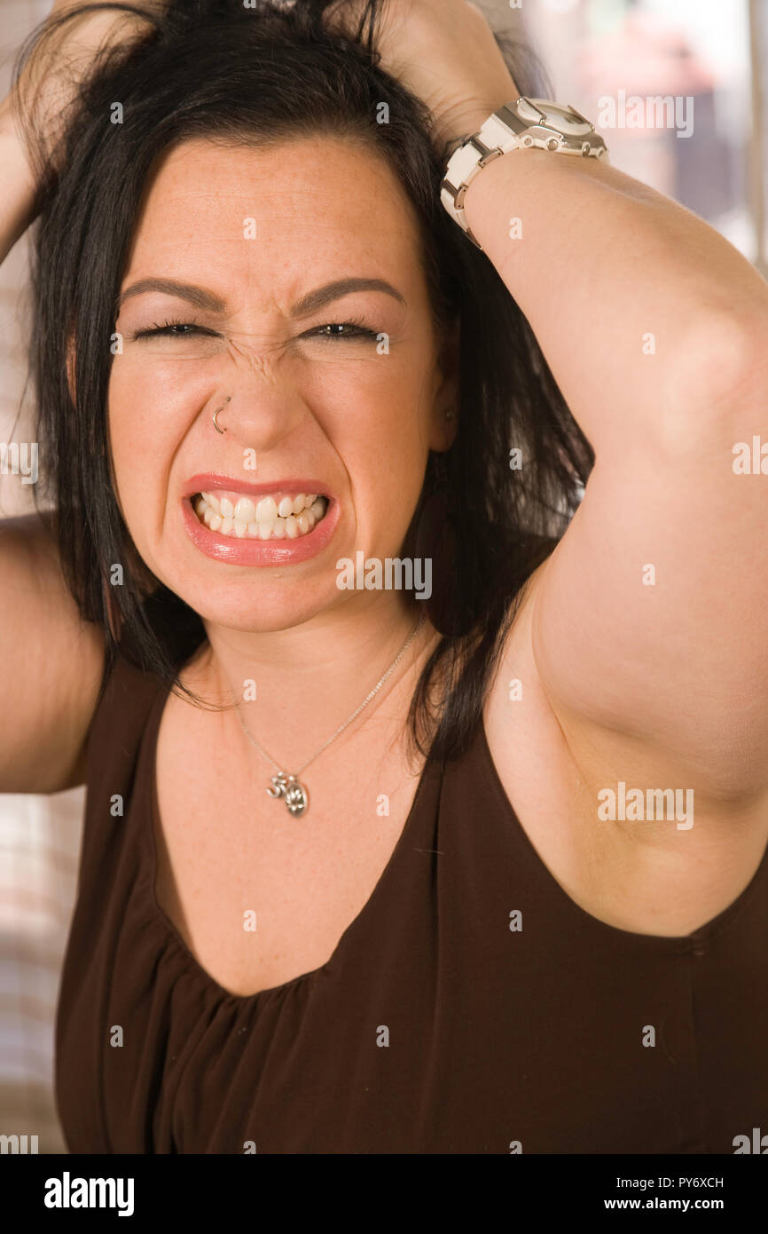 Young woman gritting teeth hires stock photography and images Alamy