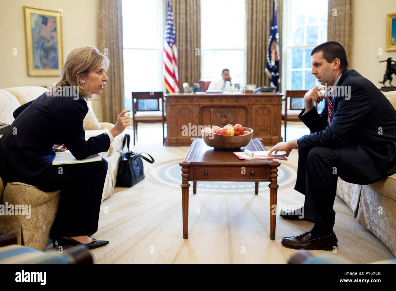 Dr. Elizabeth 'Liz' Sherwood-Randall, NSC Senior Director for European Affairs and NSC Chief of Staff Mark Lippert confer in the Oval Office while President Barack Obama talks on the phone with a foreign leader 2/16/09. Official White House Photo by Pete Souza Stock Photo