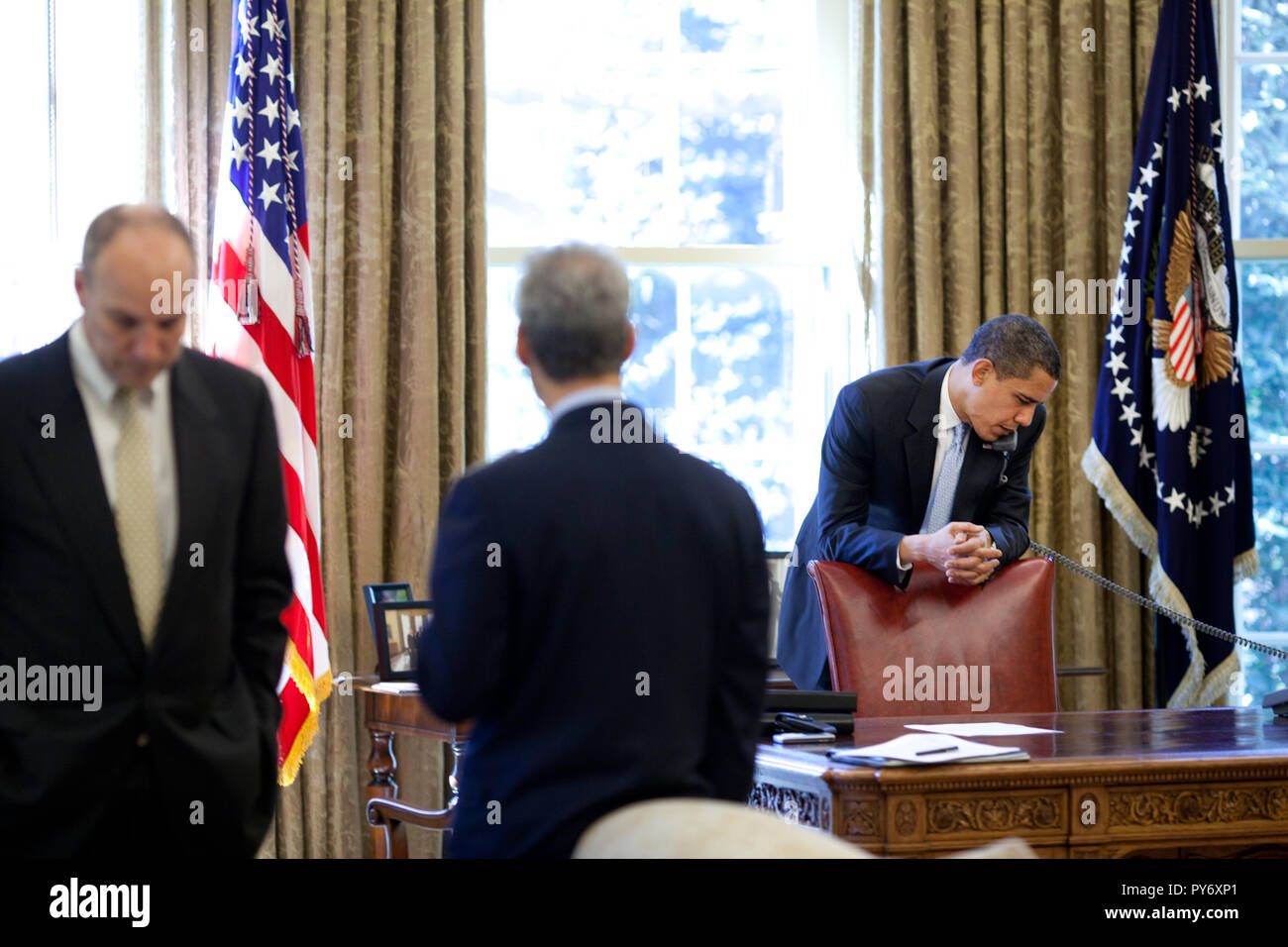 President Barack Obama makes phone calls from the Oval Office with ...