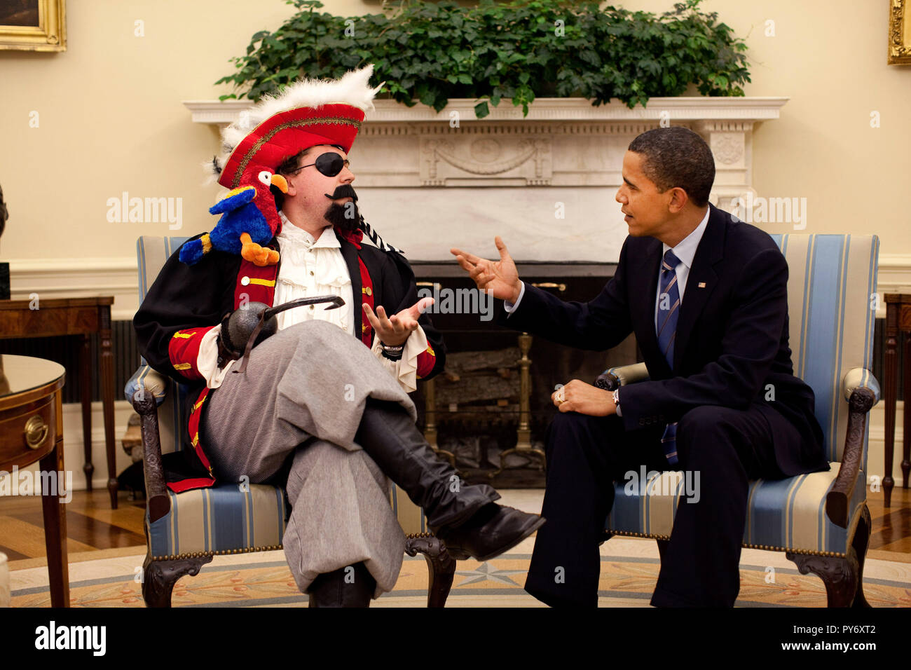 President Barack Obama with speechwriter Cody Keenan, who dressed as a pirate for an Oval Office photo shot for use in the PresidentÕs speech to the White House Correspondents Association dinner May 9, 2009. ÒBut as I said during the campaign, we can't just talk to our friends. As hard as it is, we also have to talk to our enemies, and I've begun to do exactly thatÓ the President said in his speech.  Official White House Photo by Pete Souza.  This official White House photograph is being made available for publication by news organizations and/or for personal use printing by the subject(s) of  Stock Photo