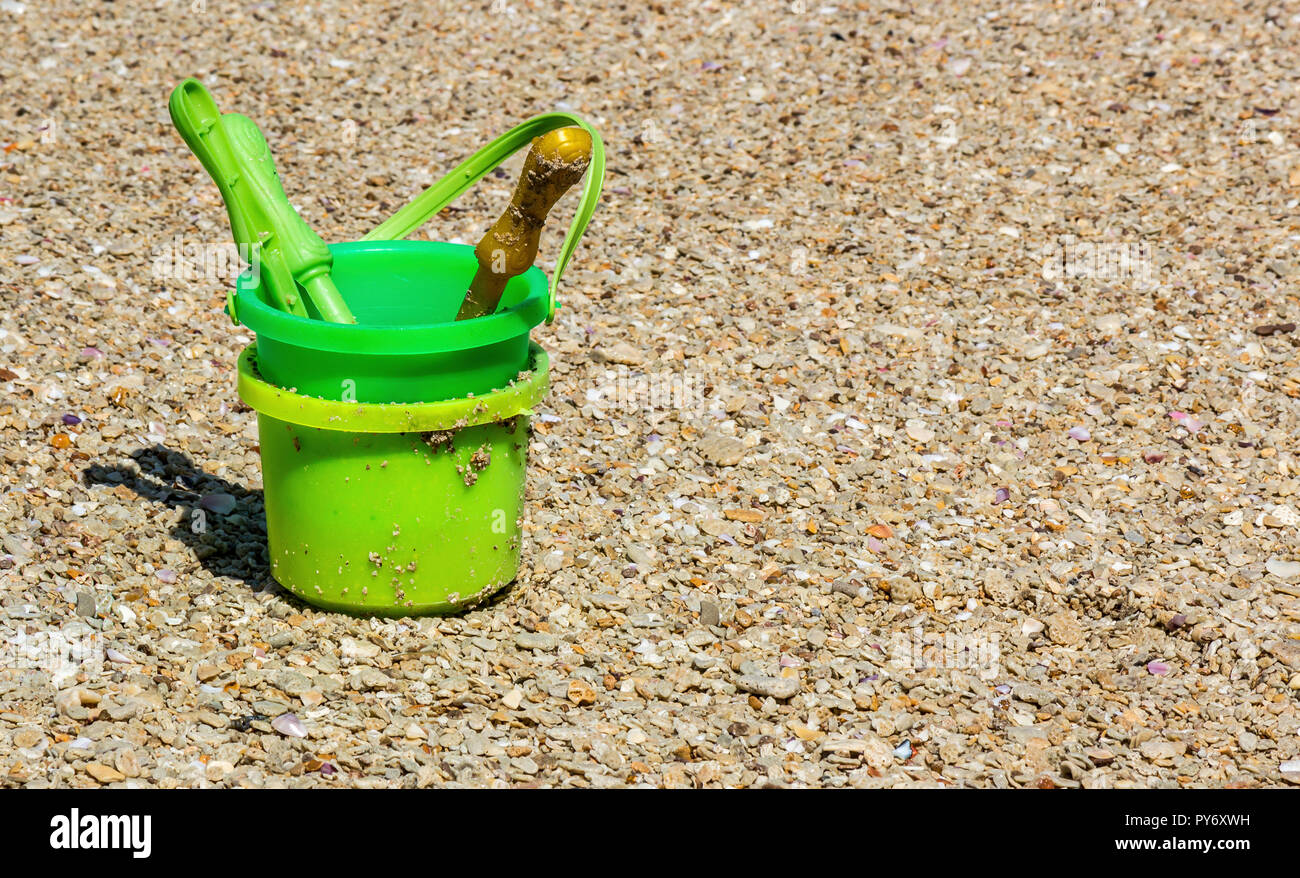 A sand bucket used for children to play and fun on the beach Stock Photo