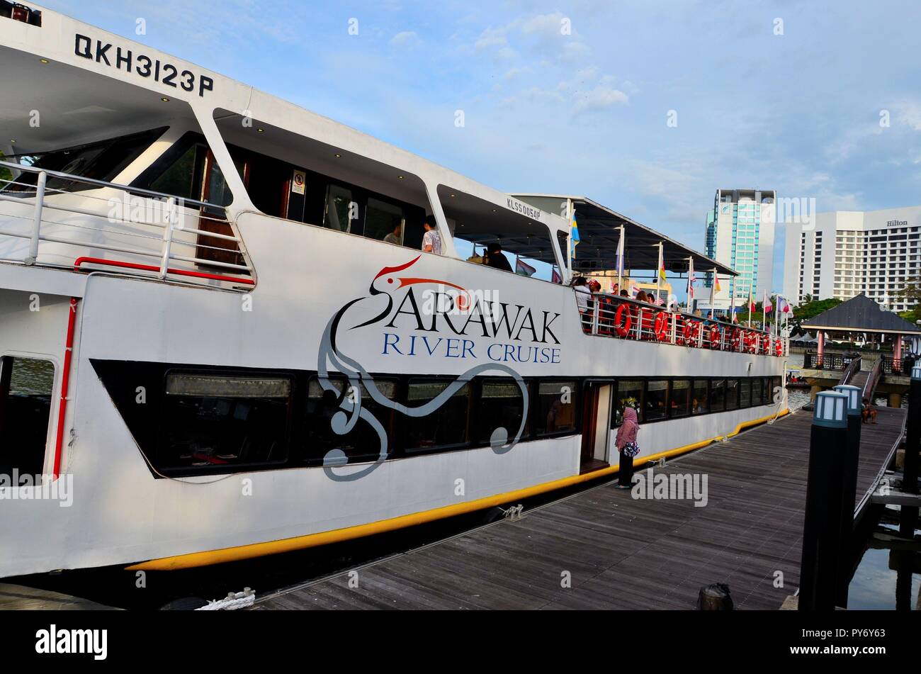 Sarawak River cruise tourism boat ferry with passengers awaits