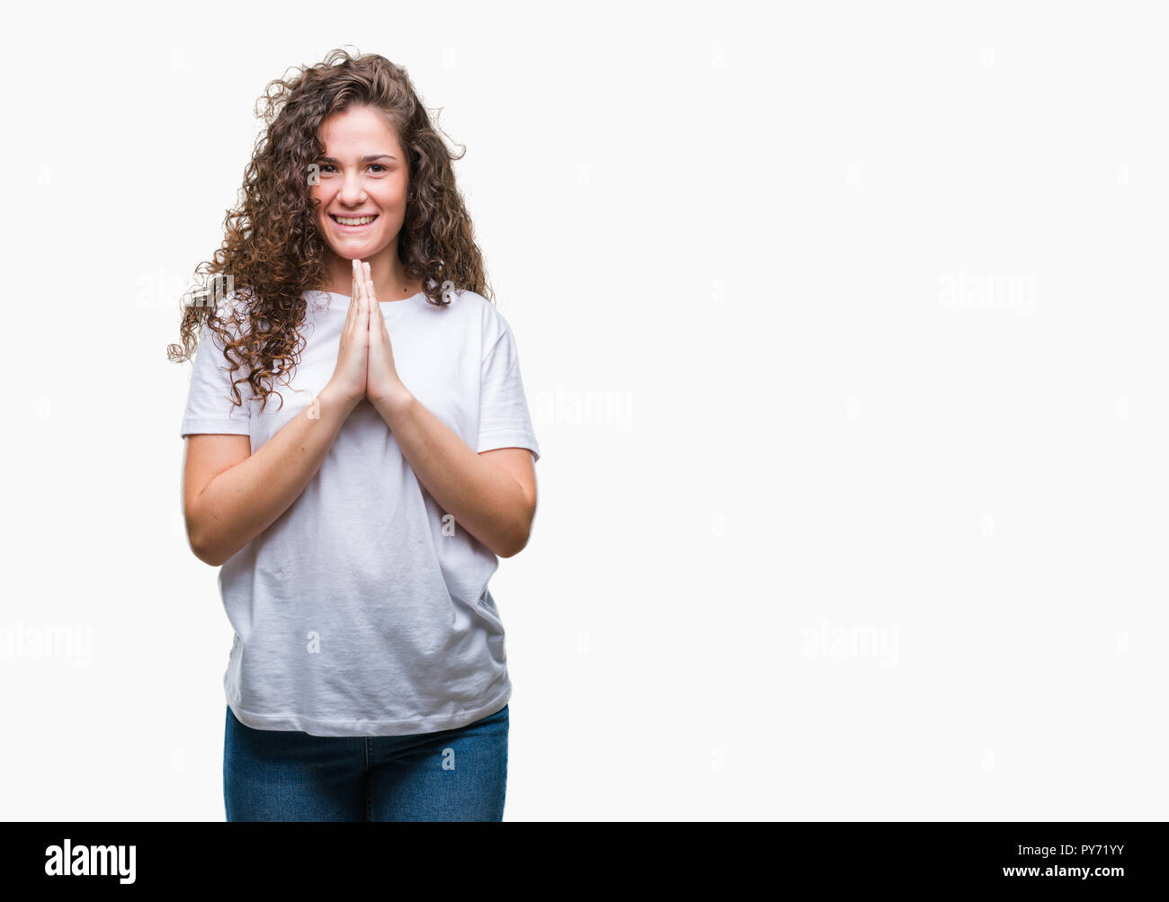Beautiful brunette curly hair young girl wearing casual t-shirt over ...