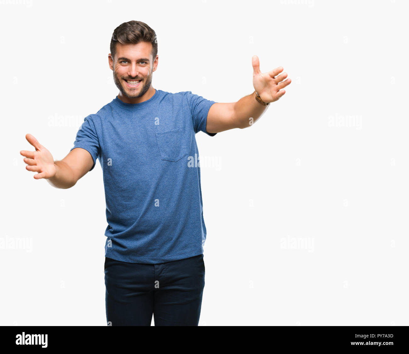 Young Handsome Man Over Isolated Background Looking At The Camera Smiling With Open Arms For Hug Cheerful Expression Embracing Happiness Stock Photo Alamy