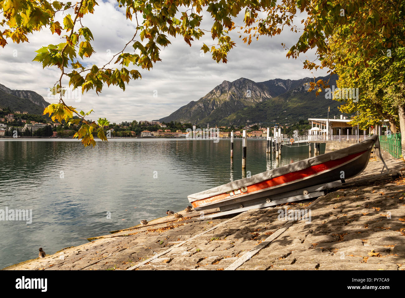 Boat on the shore of Lake Como at Lecco in the Italian mountains Stock Photo