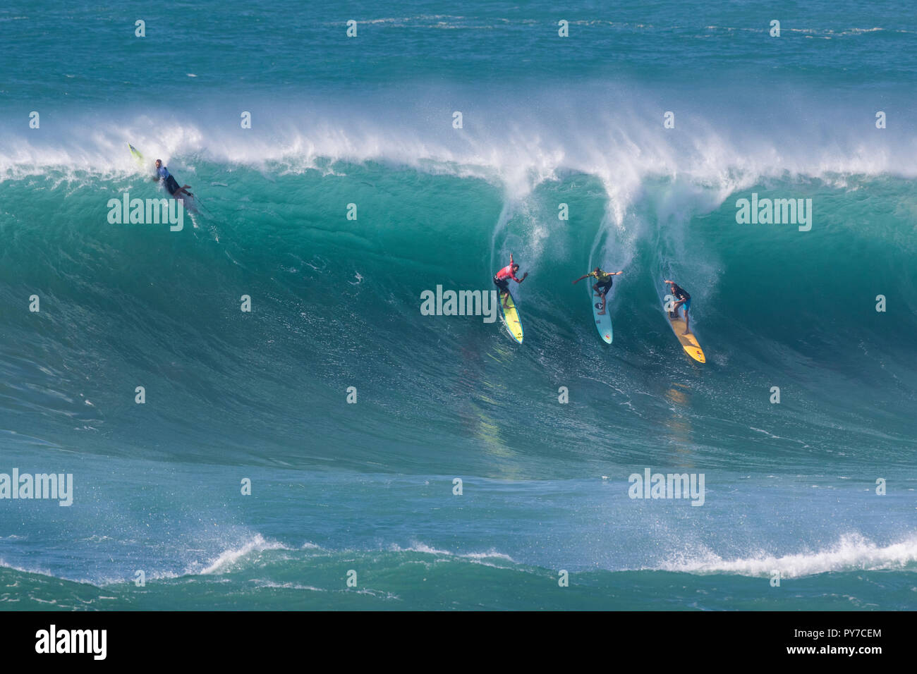 Surfers at the 2016 Eddie Aikau surf contest. Stock Photo