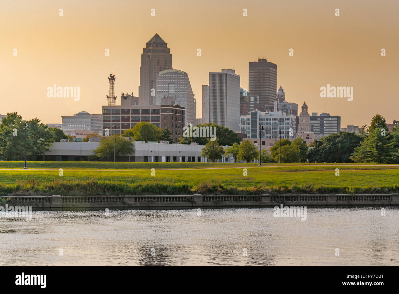 City skyline of Des Moines, Iowa across the Racoon River at sunset Stock Photo