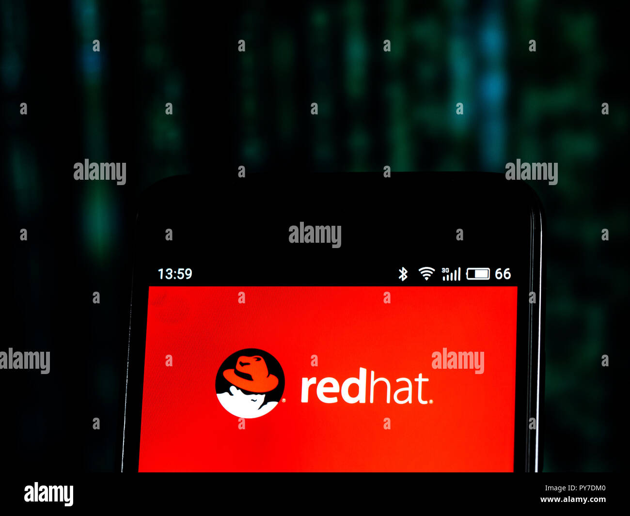 Red Hat  Software company logo seen displayed on smart phone. Red Hat, Inc. is an American multinational software company providing open-source software products to the enterprise community. Stock Photo