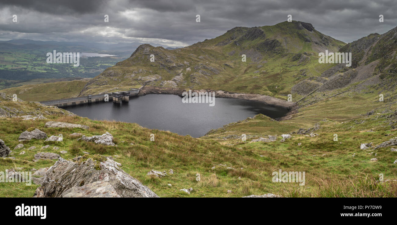 Stwlan Dam and the Moelwyn mountains near Blaenau Ffestiniog in Snowdonia. Stock Photo