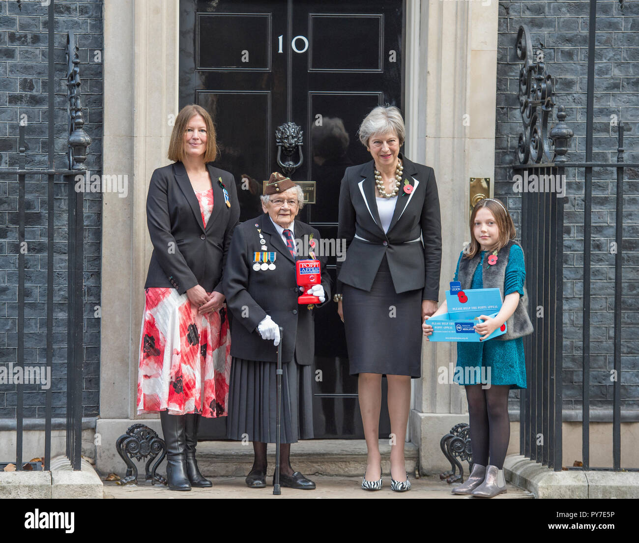 10 Downing Street, London, UK. 25 October, 2018. The Prime Minister meets fundraisers for the Royal British Legion and purchases a poppy. Stock Photo