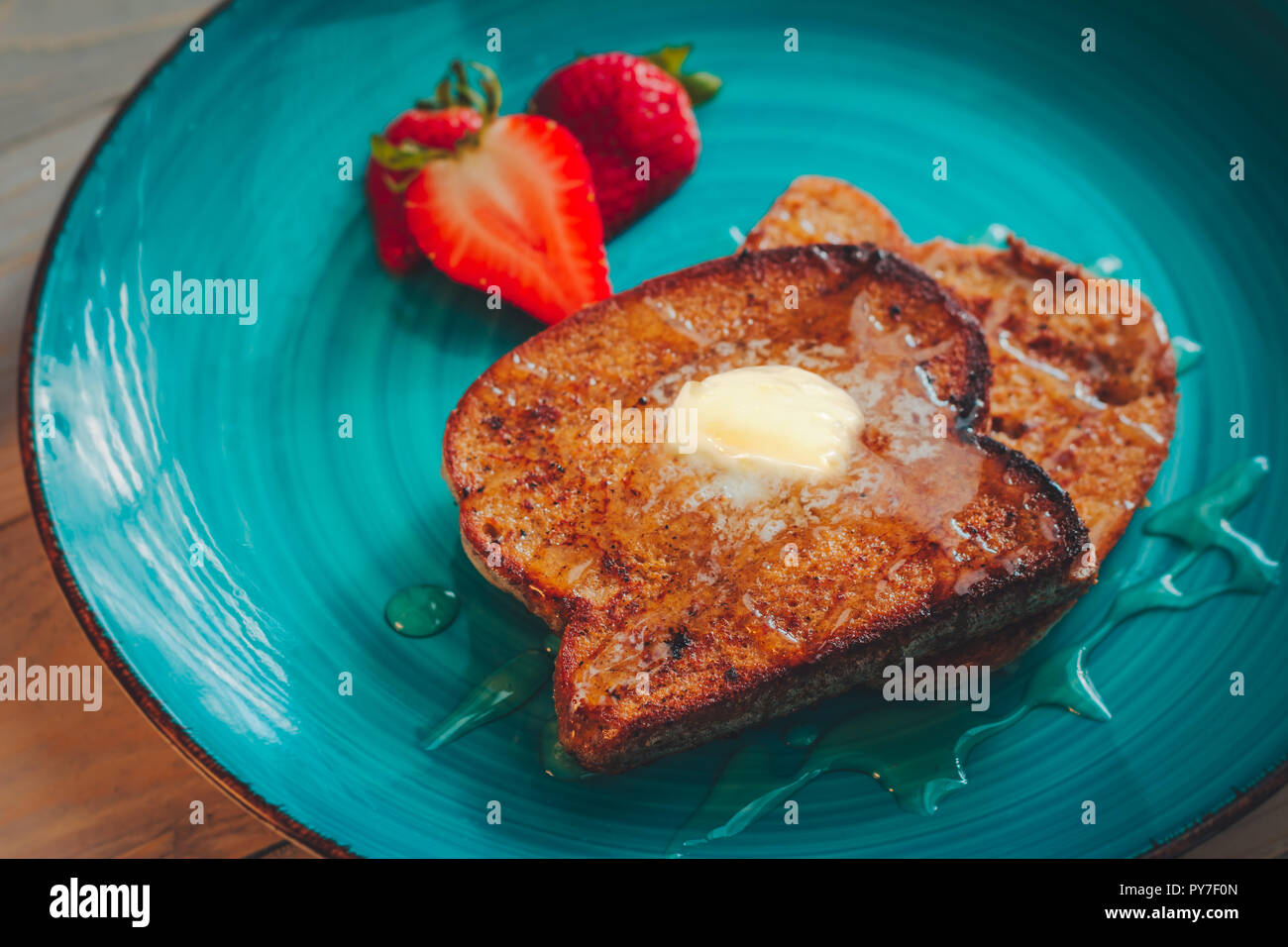 Homemade french toast with gluten free bread, strawberries and maple syrup Stock Photo Alamy