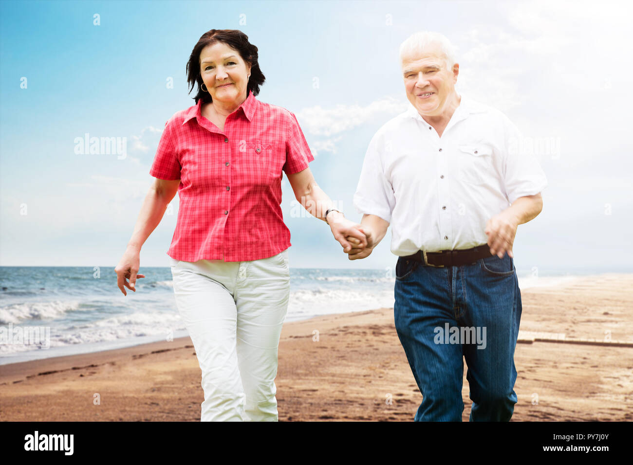 Old couple walking holding hands hi-res stock photography and images ...
