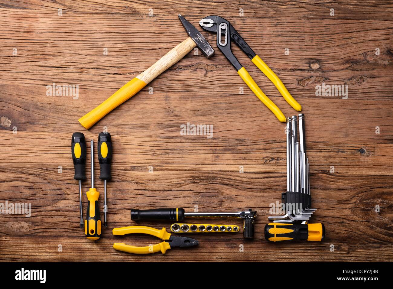 High Angle View Of Various Worktools On Wooden Background Stock Photo