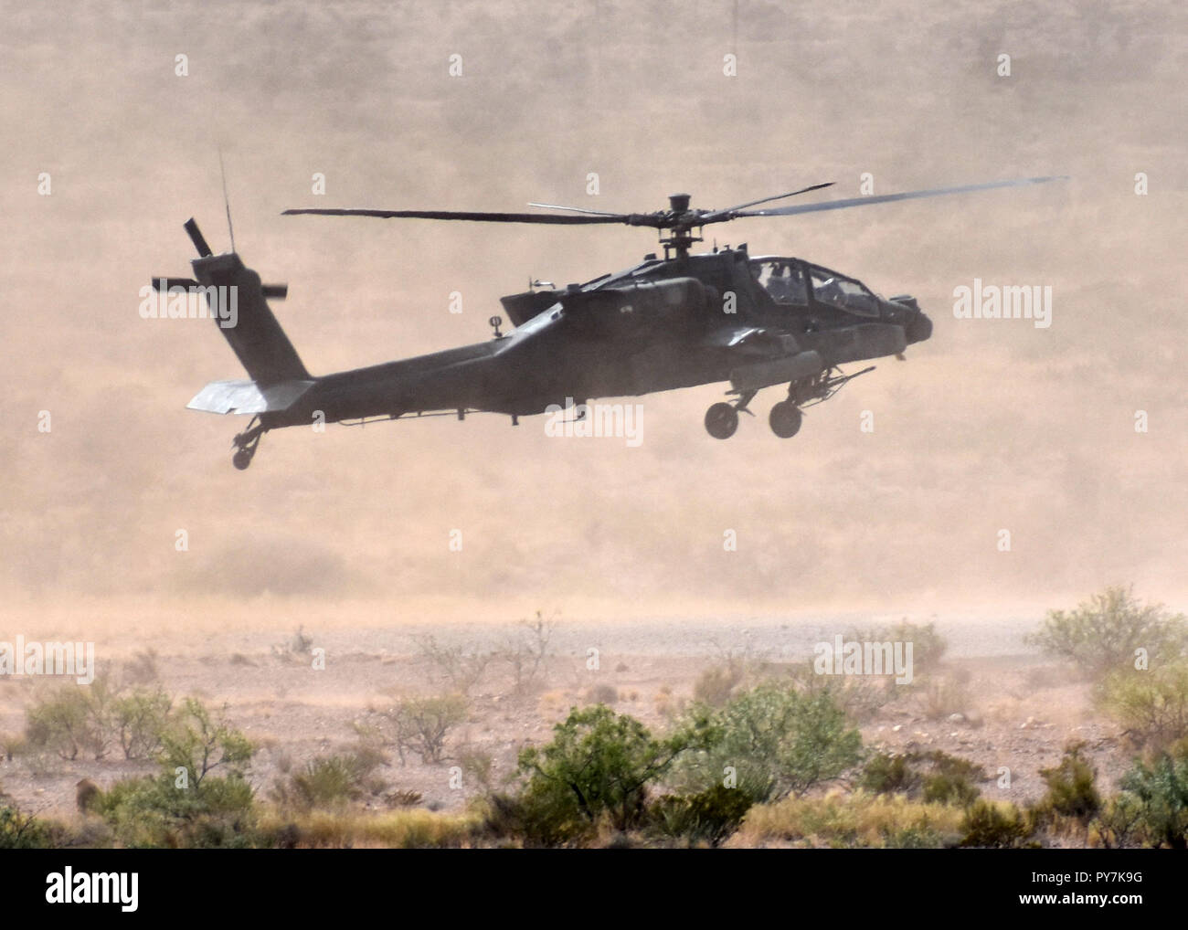 An AH-64 Apache assigned to 3rd Squadron, 6th Cavalry Regiment, Combat Aviation Brigade, 1st Armored Division lands during gunnery training at Doña Ana Range, N.M., Oct. 11, 2018. Stock Photo