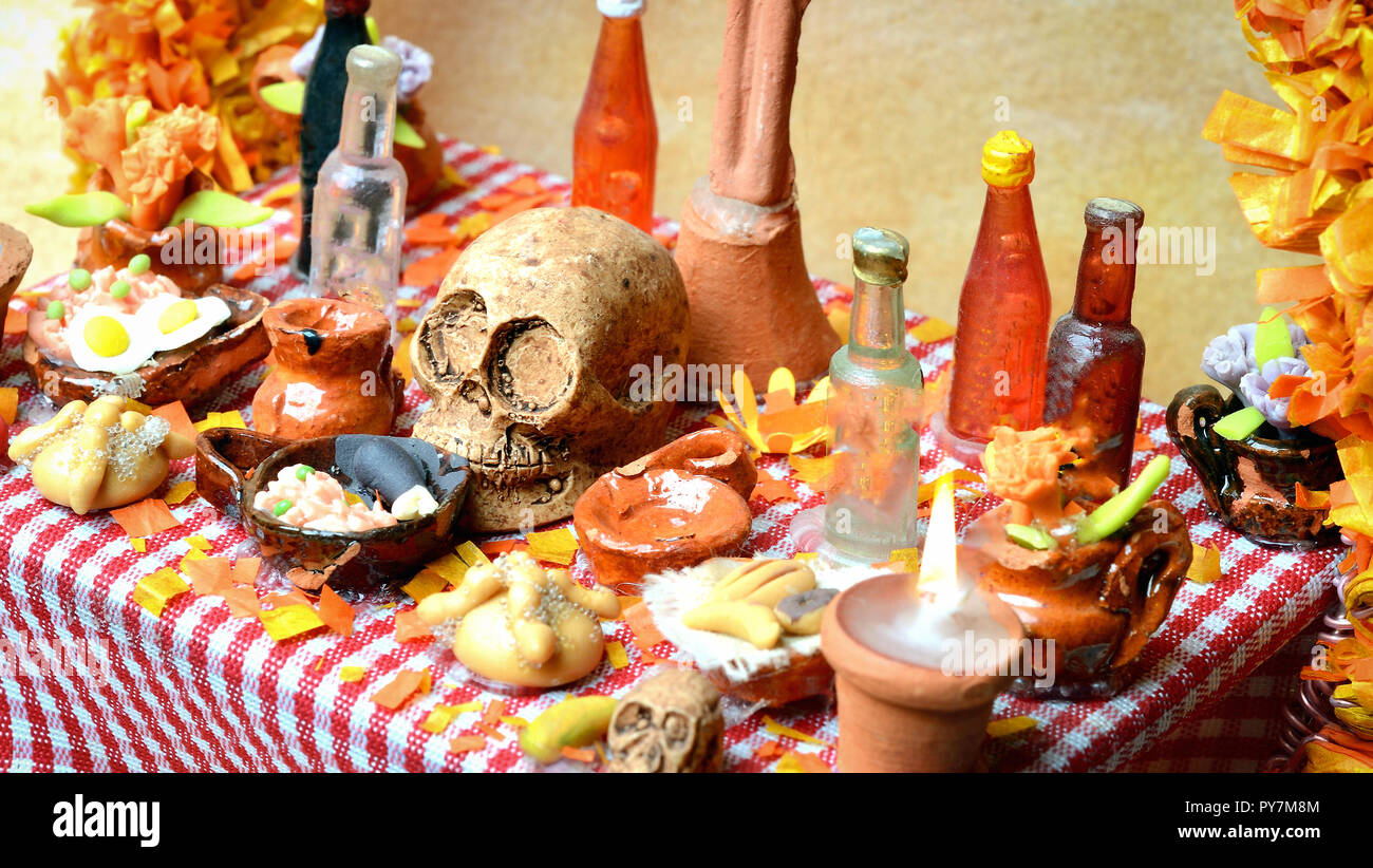 Traditional mexican Day of the dead altar with pan de muerto and candles Stock Photo