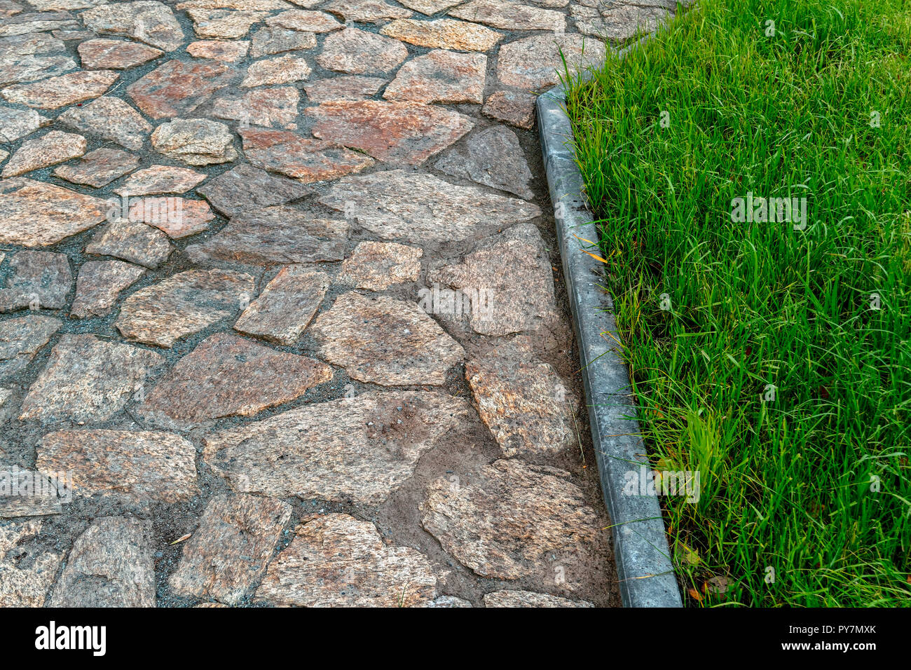 Fragment of cobblestone pavement Stock Photo