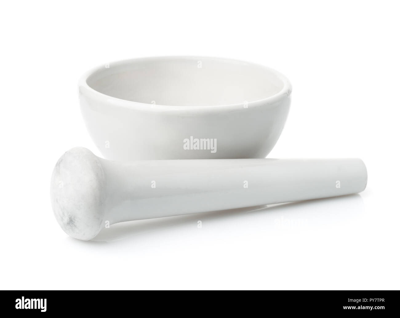 Vintage porcelain mortar and pestle isolated on white Stock Photo