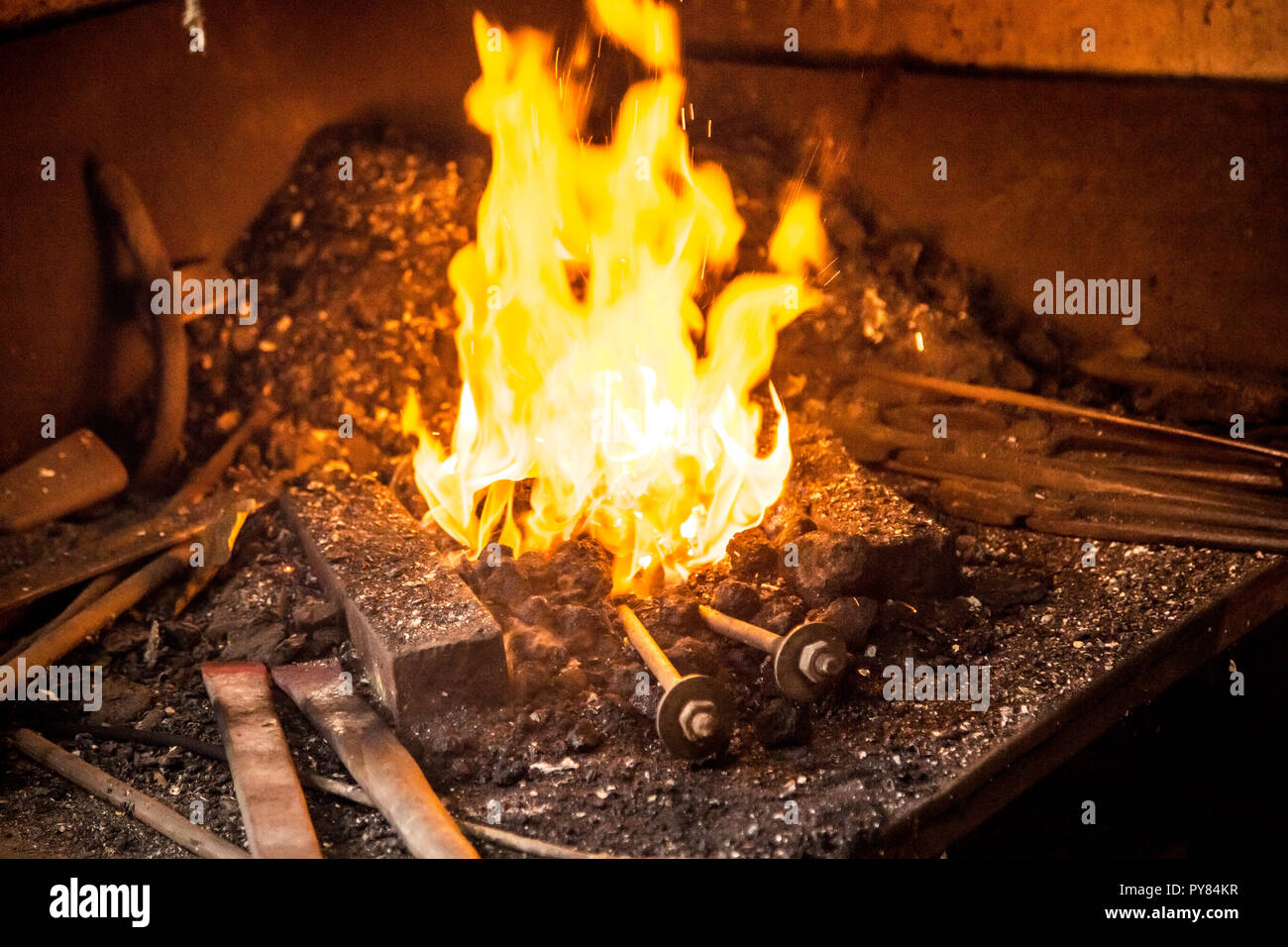 Fire of burning coal in blacksmiths factory Stock Photo Alamy