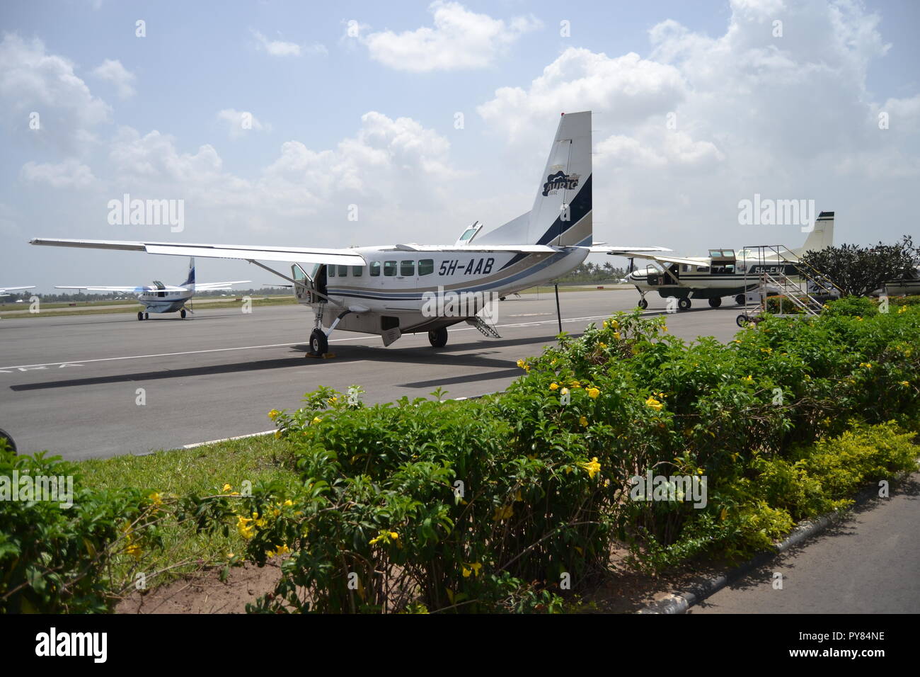 Small planes in Dar es Salam Airport, Tanzania. Traveling to Zanzibar and back. Stock Photo