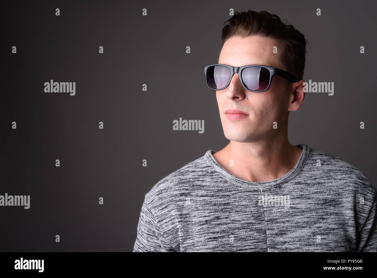 Portrait of young handsome man wearing sunglasses Stock Photo