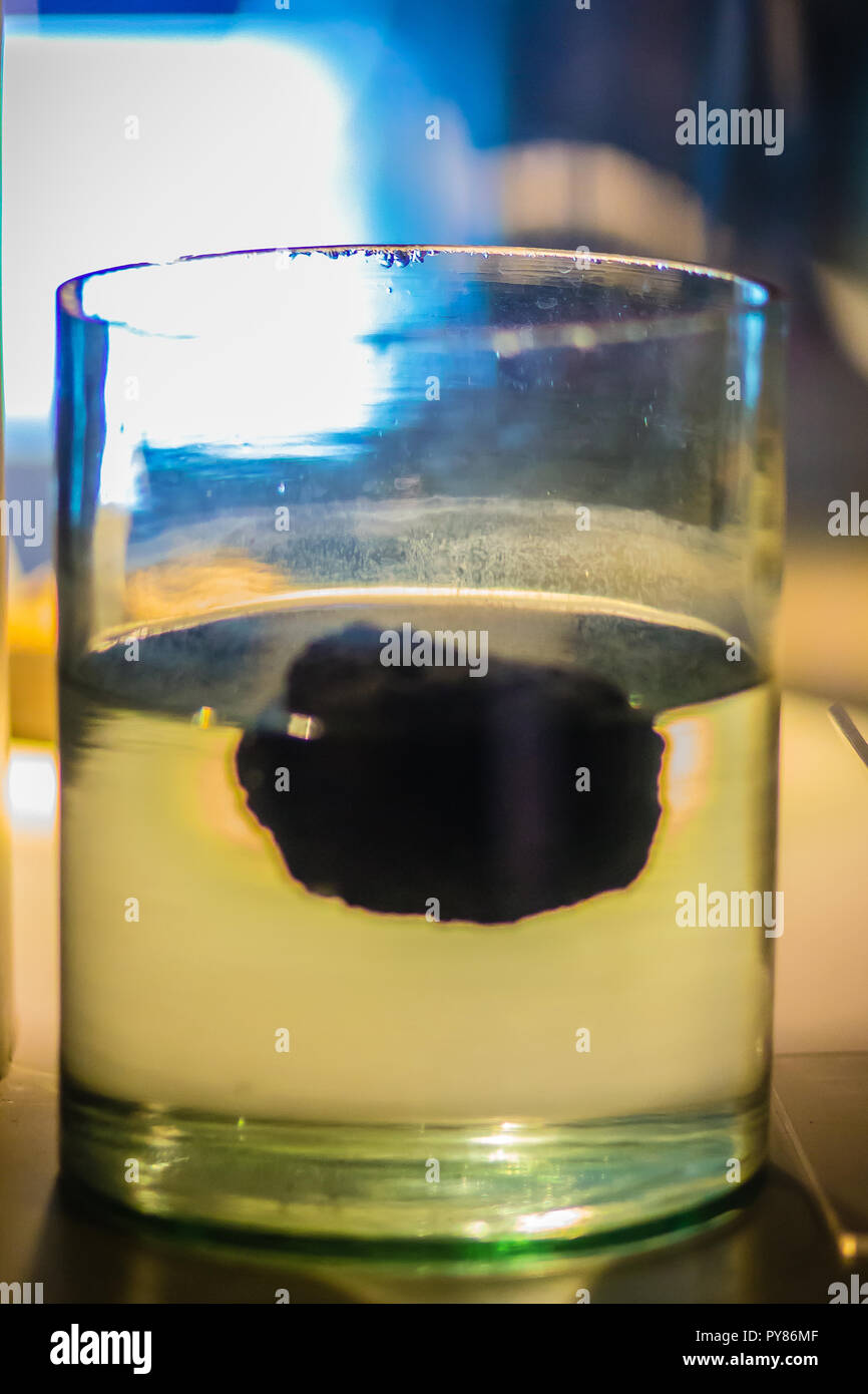 Pumice stone is floating on the water. Pumice has an average porosity